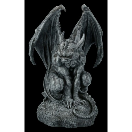 Gargoyle sitting on Stone