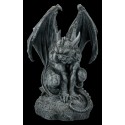 Gargoyle sitting on Stone